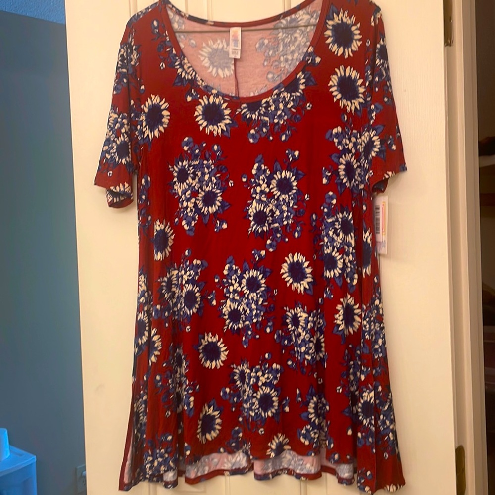 Lularoe xs floral top or dress depending how tall you are. Nwt